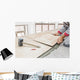 Handyman laying tile, trowel with mortar Wall Mural