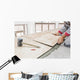 Handyman laying tile, trowel with mortar Wall Mural