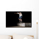 boy doing skateboard trick in skate park on night Wall Mural
