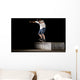 boy doing skateboard trick in skate park on night Wall Mural