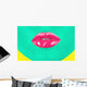 Close-up portrait of girl with green skin and pink lips Wall Mural