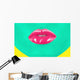 Close-up portrait of girl with green skin and pink lips Wall Mural