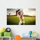 Woman golf player swinging with golf club Wall Mural