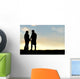 Silhouette of Happy Couple Holding Hands and Talking at Sunset Wall Mural