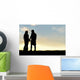 Silhouette of Happy Couple Holding Hands and Talking at Sunset Wall Mural