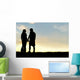 Silhouette of Happy Couple Holding Hands and Talking at Sunset Wall Mural