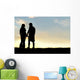 Silhouette of Happy Couple Holding Hands and Talking at Sunset Wall Mural