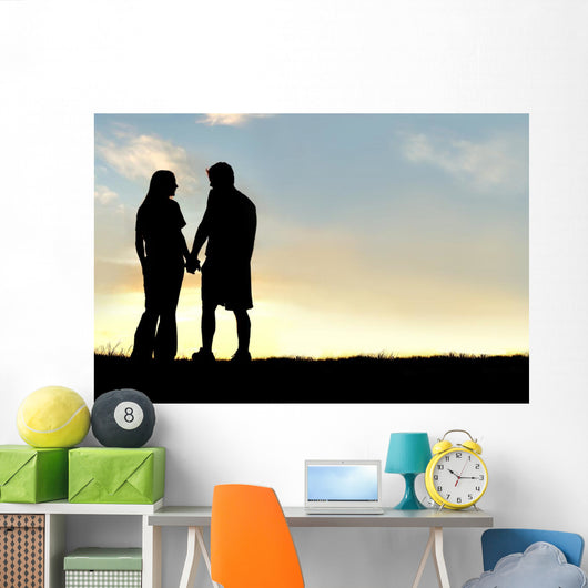 Silhouette of Happy Couple Holding Hands and Talking at Sunset Wall Mural