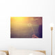 Woman blowing dandelion Wall Mural