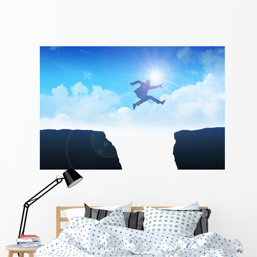 Man jumping over the ravine Wall Mural
