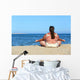 overweight woman meditation on beach Wall Mural