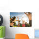 Friends play volleyball on the beach Wall Mural