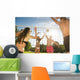Friends play volleyball on the beach Wall Mural