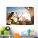 Friends play volleyball on the beach Wall Mural