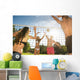 Friends play volleyball on the beach Wall Mural