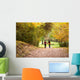 Young love couple, holding hands walking in the autumn forest Wall Mural