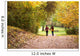 Young love couple, holding hands walking in the autumn forest Wall Mural
