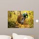 Mountainbiker Rides Autumn Forest