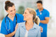 nurse talking to senior woman Wall Mural