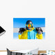 Snowboarder holding snowboard Wall Mural