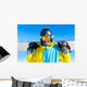 Snowboarder holding snowboard Wall Mural