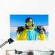 Snowboarder holding snowboard Wall Mural
