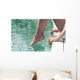 Young Woman Sitting at Poolside with Toes on Water Wall Mural