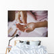 Earrings from pearls in hands 1278. Wall Mural