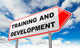 Training and Development on Red Road Sign. Wall Mural