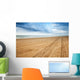 Perspective of tyre tracks on sandy beach Wall Mural