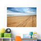 Perspective of tyre tracks on sandy beach Wall Mural