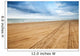 Perspective of tyre tracks on sandy beach Wall Mural