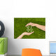 Open hands making a protection gesture Wall Mural