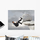 Young businessman scaling a rock Wall Mural