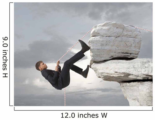 Young businessman scaling a rock Wall Mural