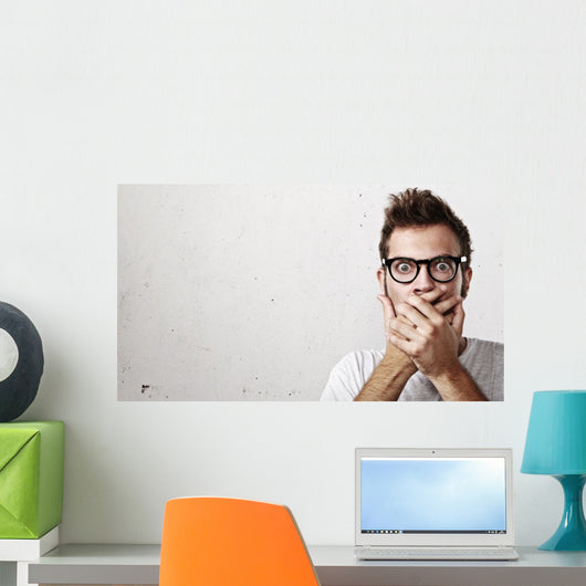 Shocked man covering his mouth with hands Wall Mural