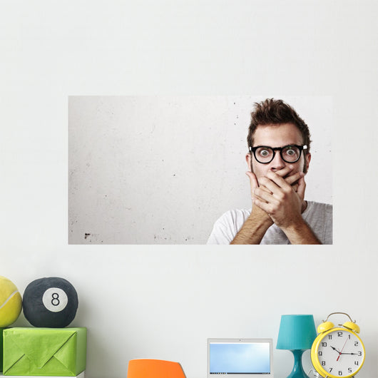 Shocked man covering his mouth with hands Wall Mural
