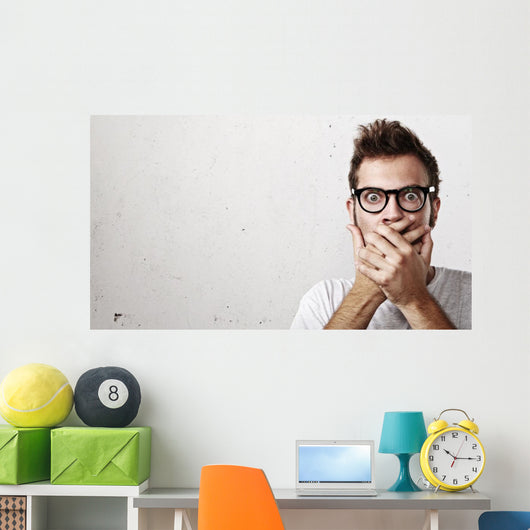 Shocked man covering his mouth with hands Wall Mural