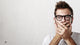 Shocked man covering his mouth with hands Wall Mural