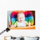 Adorable baby eating in high chair Wall Mural