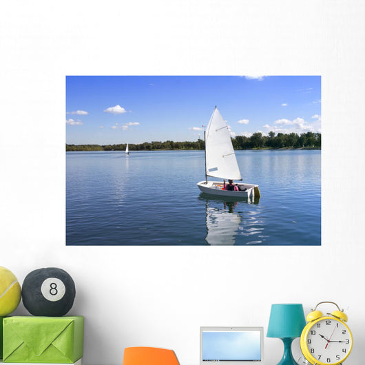 White boat sailing Wall Mural