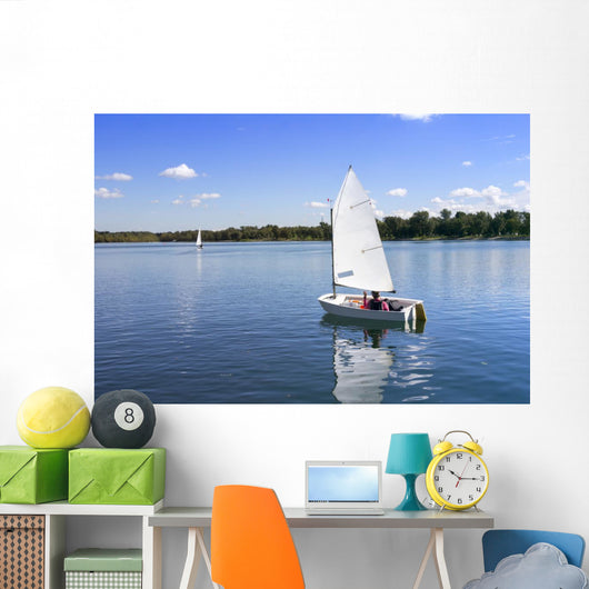 White boat sailing Wall Mural
