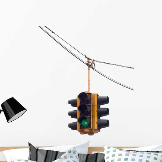 Green traffic light hanging from a cable, isolated on white. Wall Decal