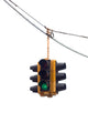 Green traffic light hanging from a cable, isolated on white. Wall Decal