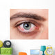 Irritated red bloodshot eye Wall Mural
