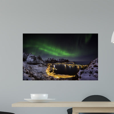 Northern Lights over Reine shown on a wall