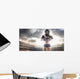 American football female player is posing Wall Mural
