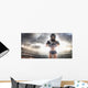 American football female player is posing Wall Mural
