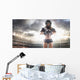 American football female player is posing Wall Mural
