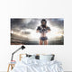 American football female player is posing Wall Mural